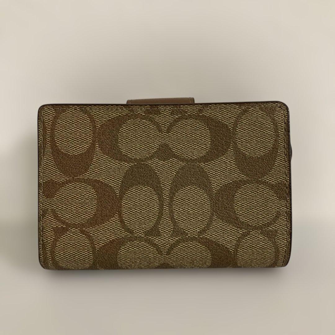〔新品　未使用〕COACHコーチ　シグネチャー 二つ折り財布